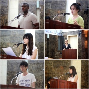 Estudiantes universitarios representando las naciones del Grupos de los seis insisten en la unificación Coreana. 